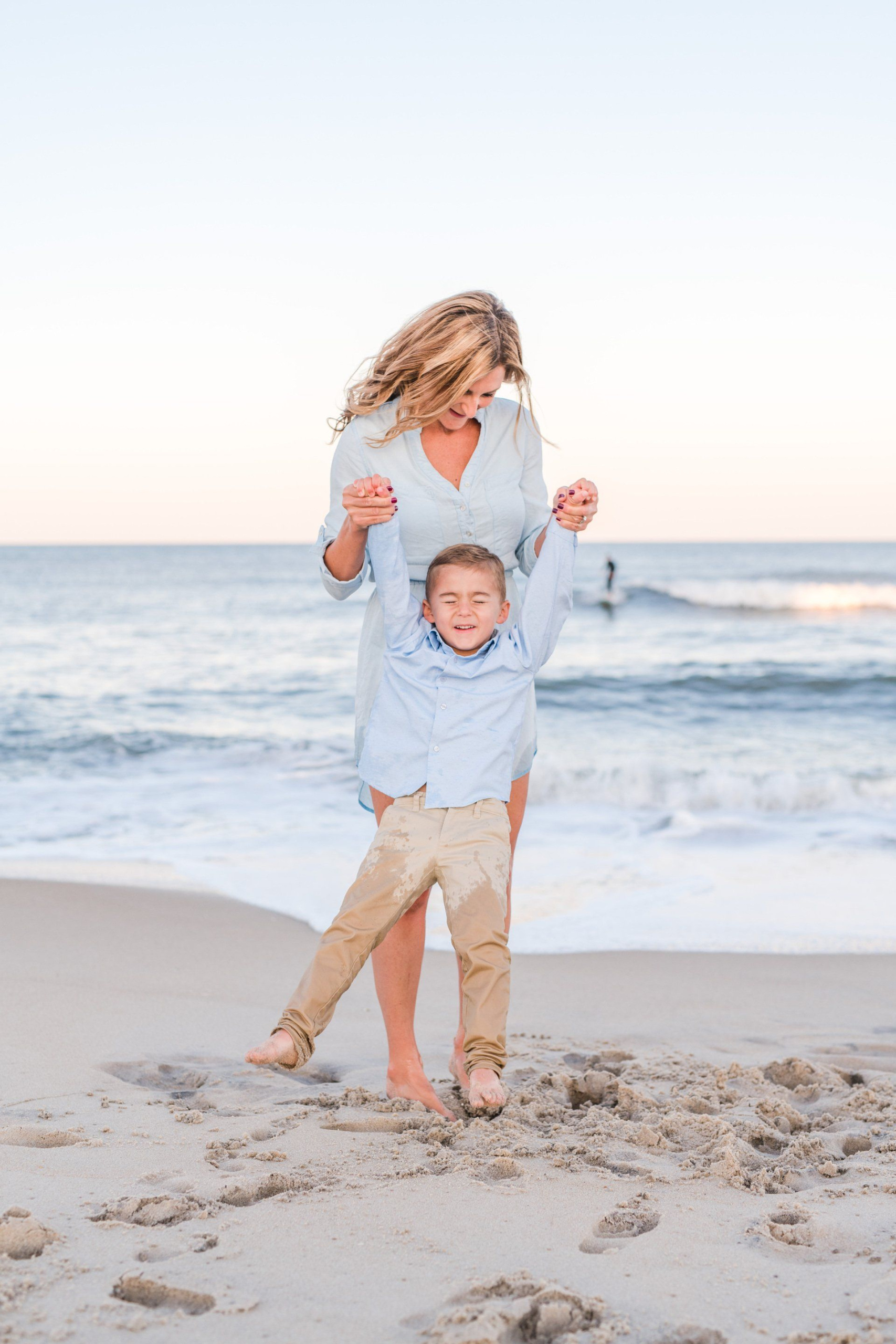 Women's health specialist Dr. Kimberly with her young son playing on the beach.