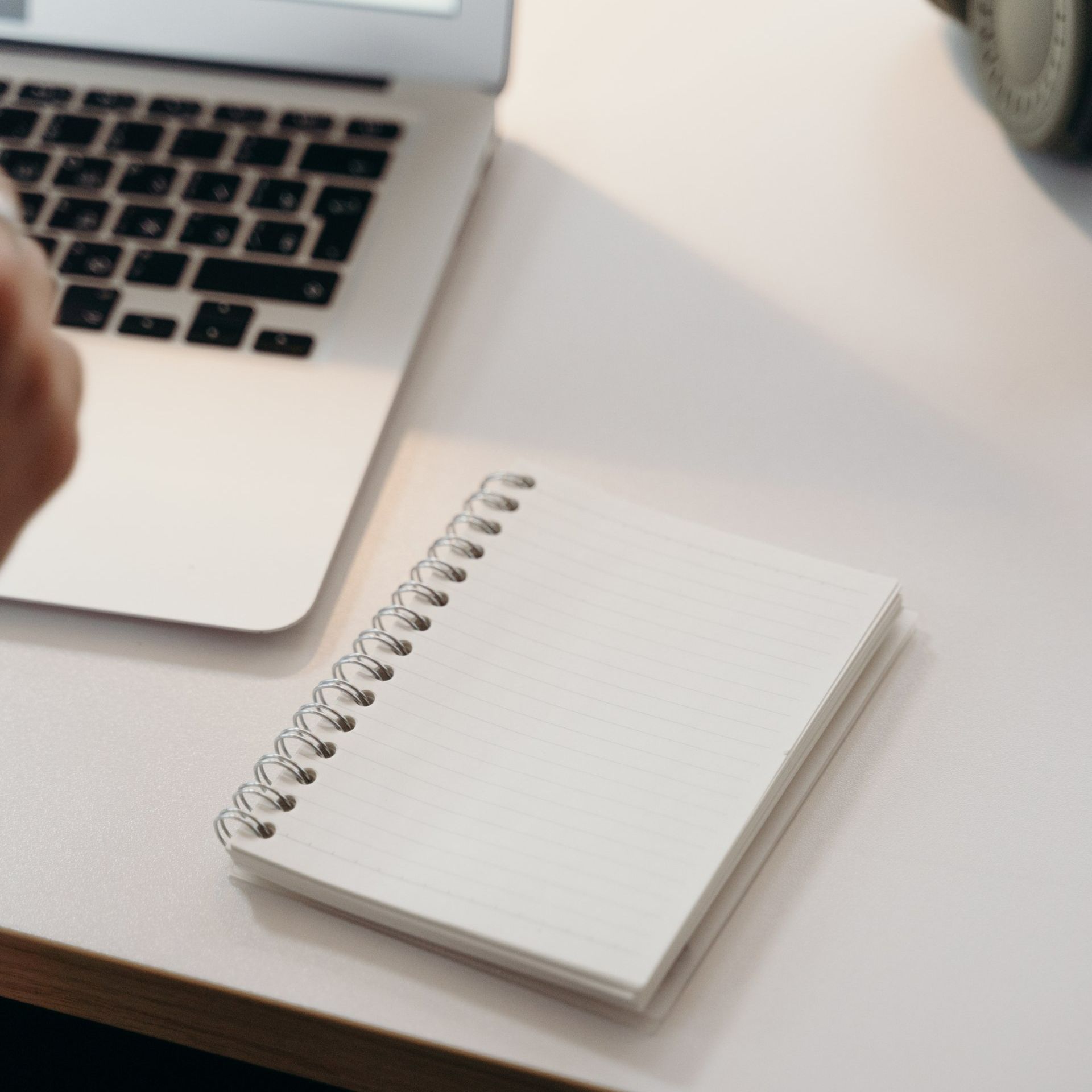 A notepad and laptop Dr. Kimberly uses for Online Holistic Wellness Courses.