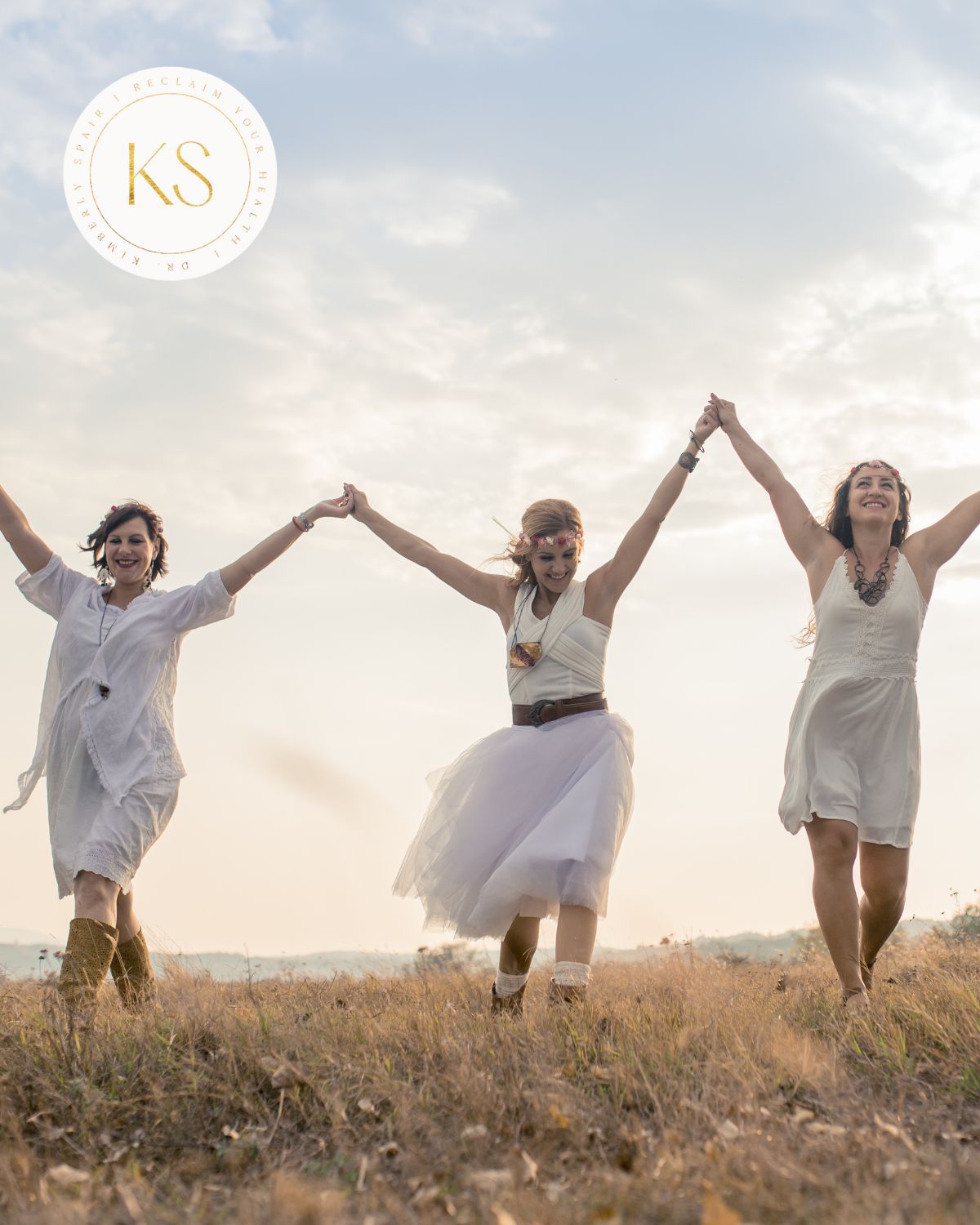 Dr. Kimberly holding hands with two other women.