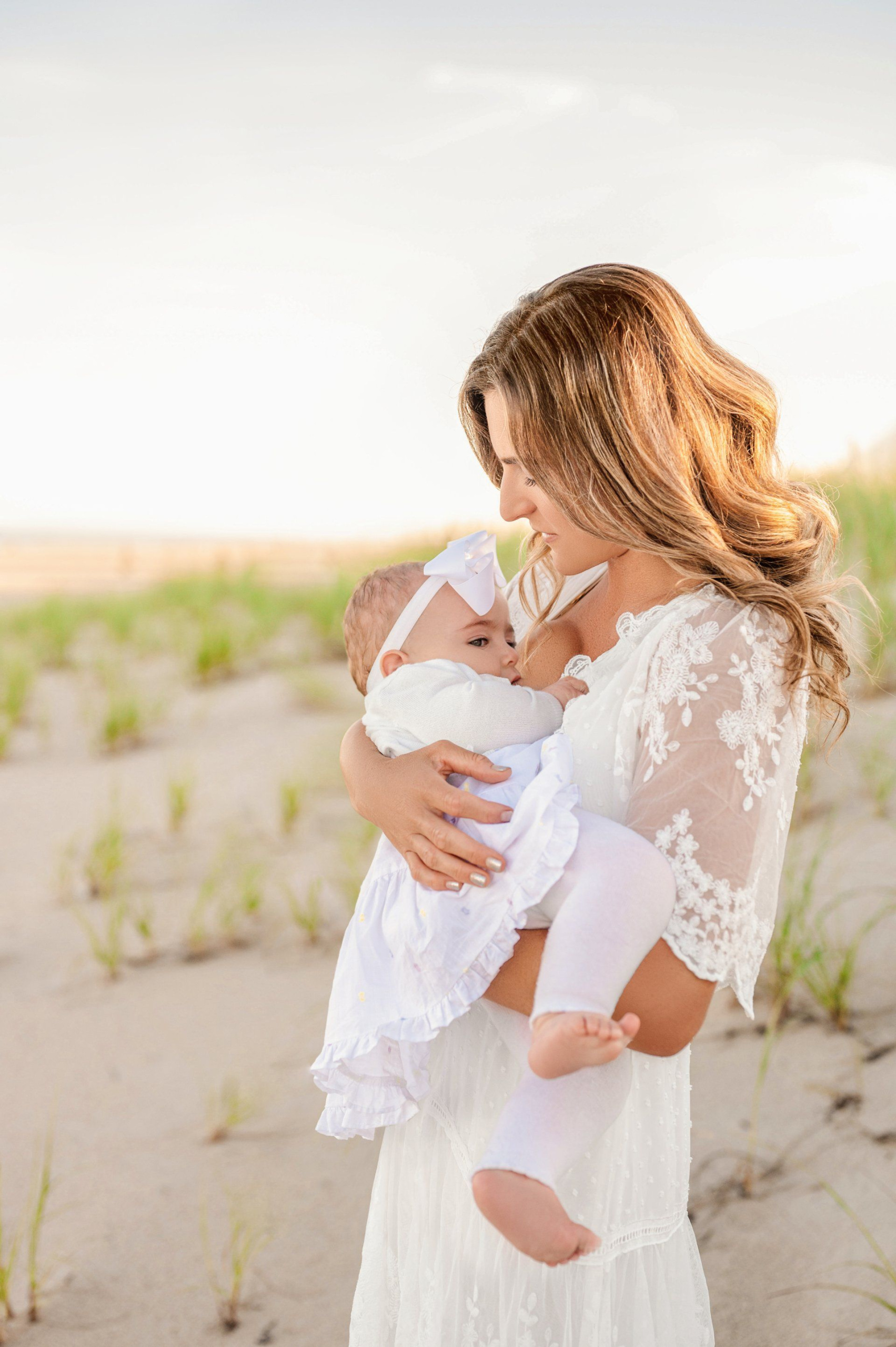 Dr. Kimberly breastfeeding her baby after going through fertility and pregnancy challenges.