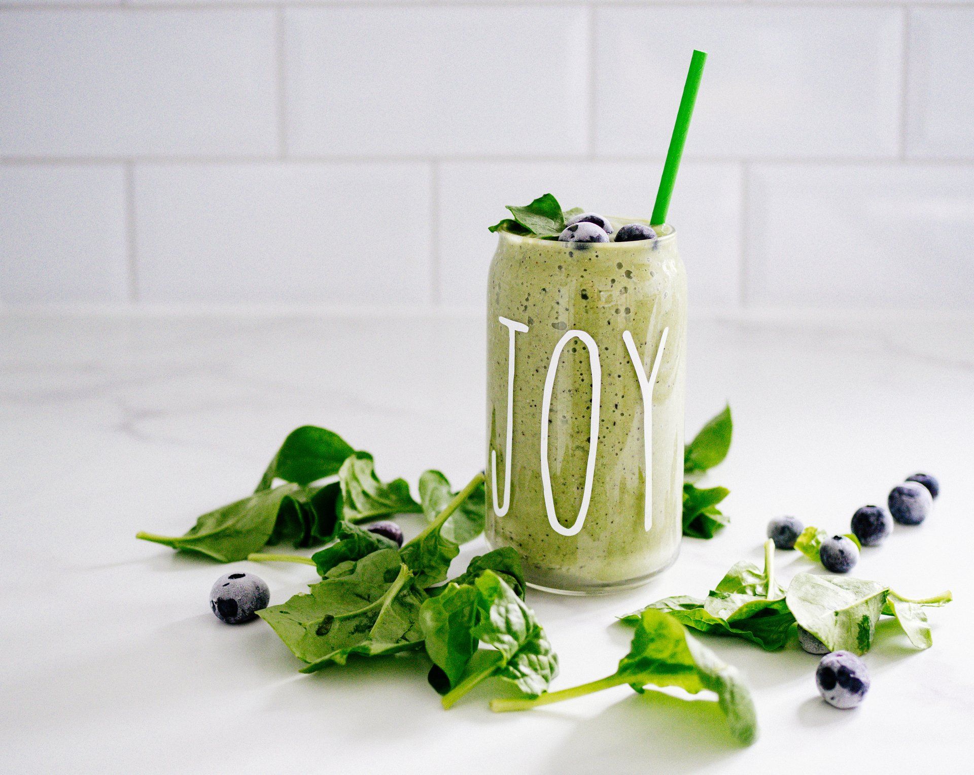 Start a healing journey with a green smoothie with spinach and blueberries.
