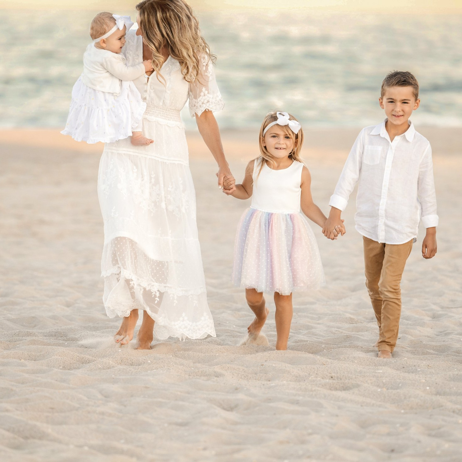 Dr. Kimberly on the beach with her three young children leading a holistic health and nutrition lifestyle.