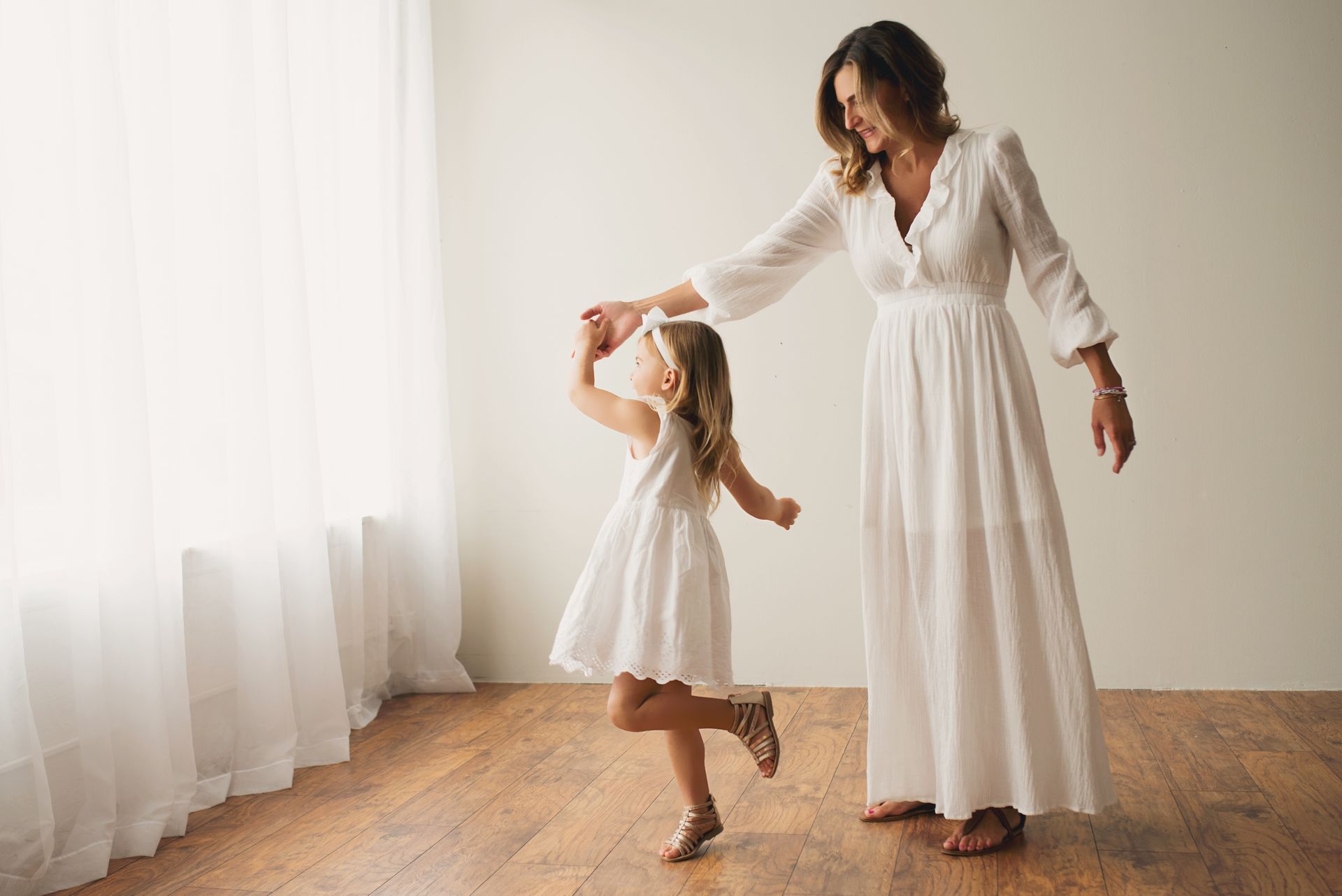 Dr. Kimberly dancing with her young daughter during a practitioner support course.