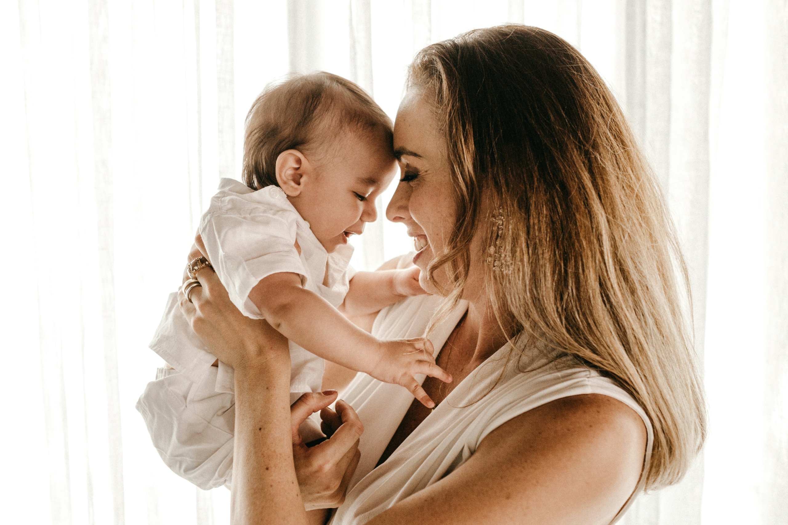 A young mother holding her baby.